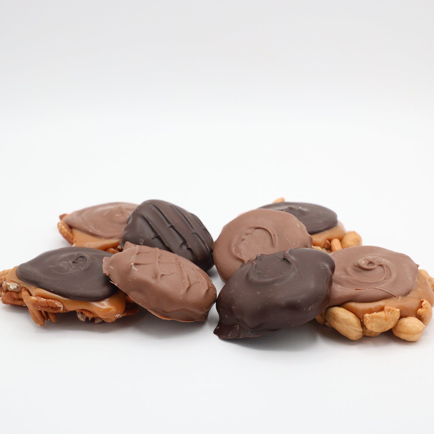 Collection of homemade nut, caramel, and chocolate based products