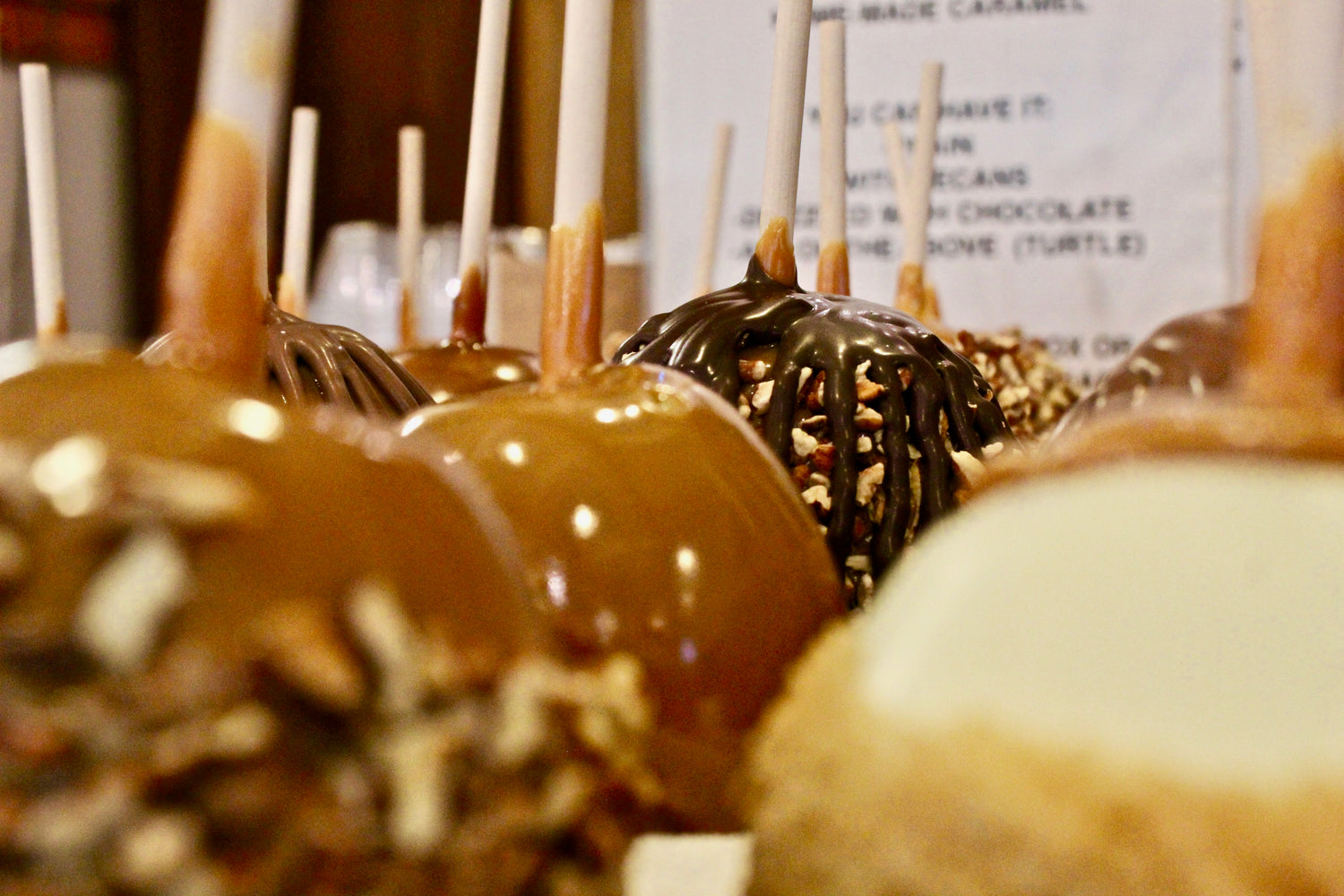 Handmade caramel apple with nuts and chocolate drizzle