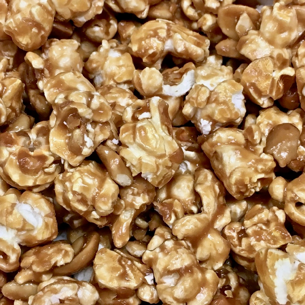 Gourmet popcorn coated in chocolate and caramel and nuts