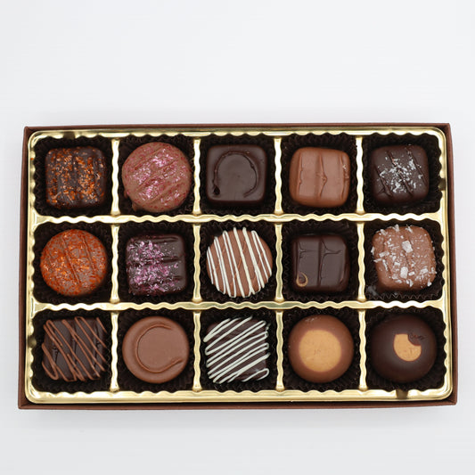 Box of assorted chocolates on a white background