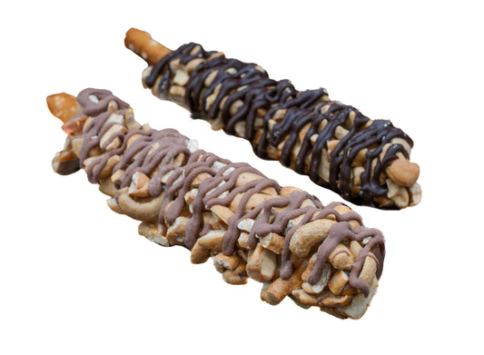 Chocolate caramel pretzel stick topped with roasted cashews