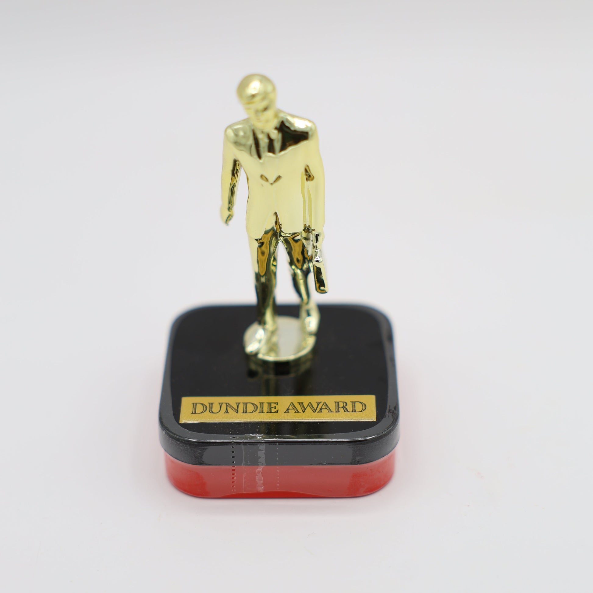 Gold style Dundie award candy trophy with candy in base