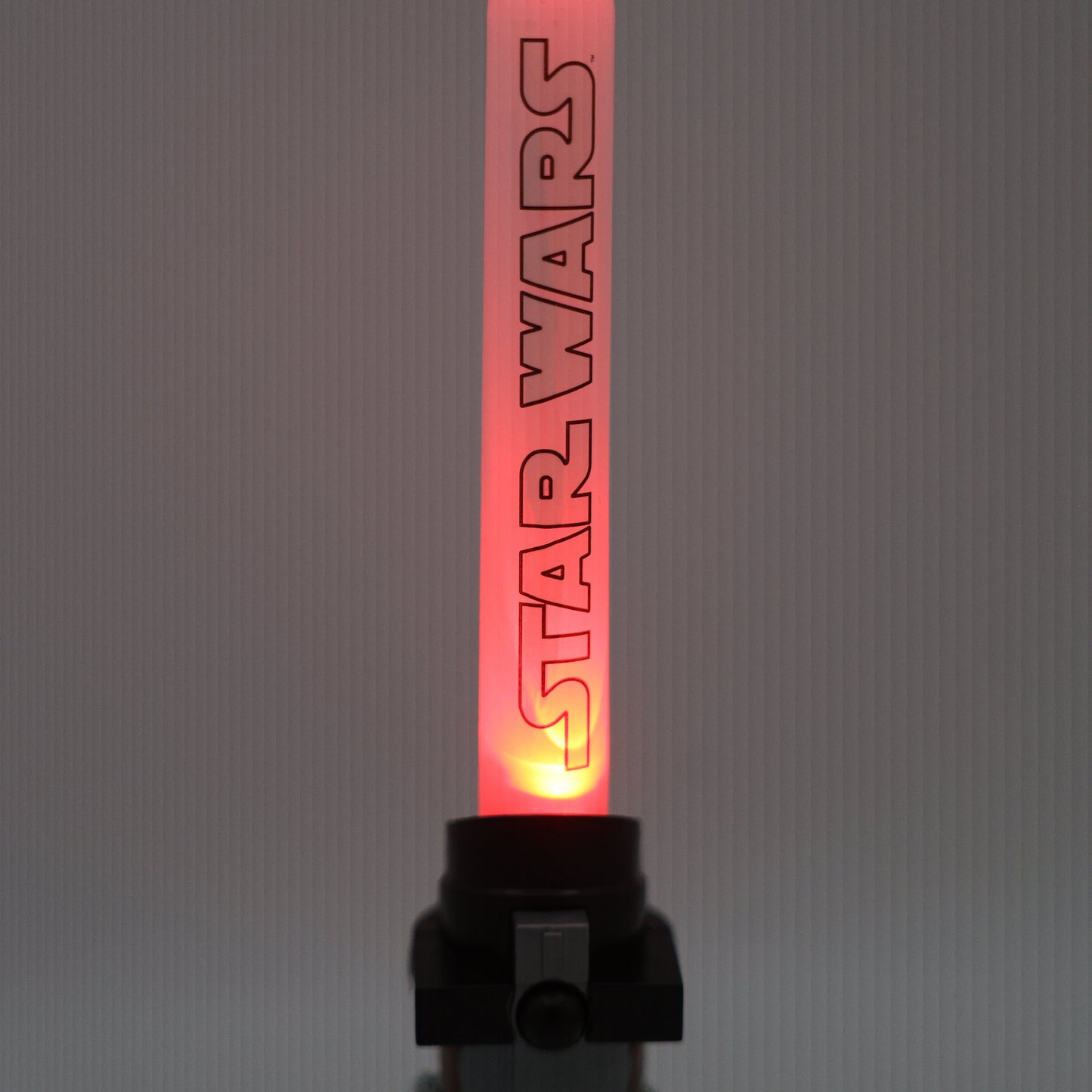 Light up candy saber toy with candy filled handle